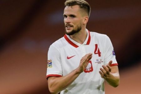 Tomasz Kedziora performs for Poland against Iceland